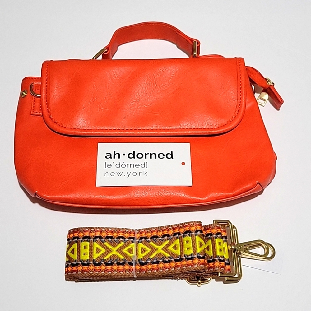 NWT Ahdorned Orange Purse. Comes with strap. 11 x 7 inches